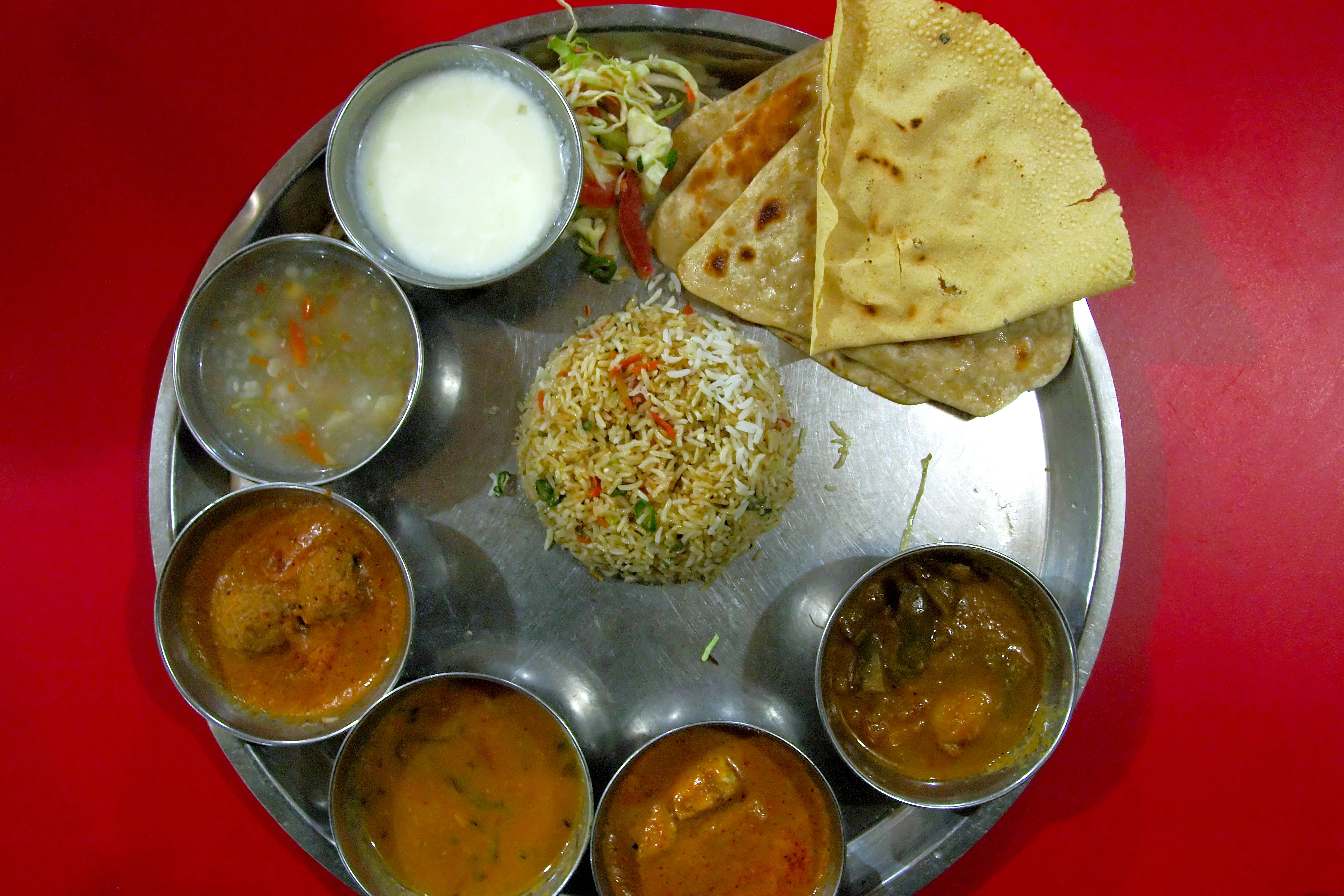 Family celebrating birthday dinner with delicious food at Vatsalaa Haldwani